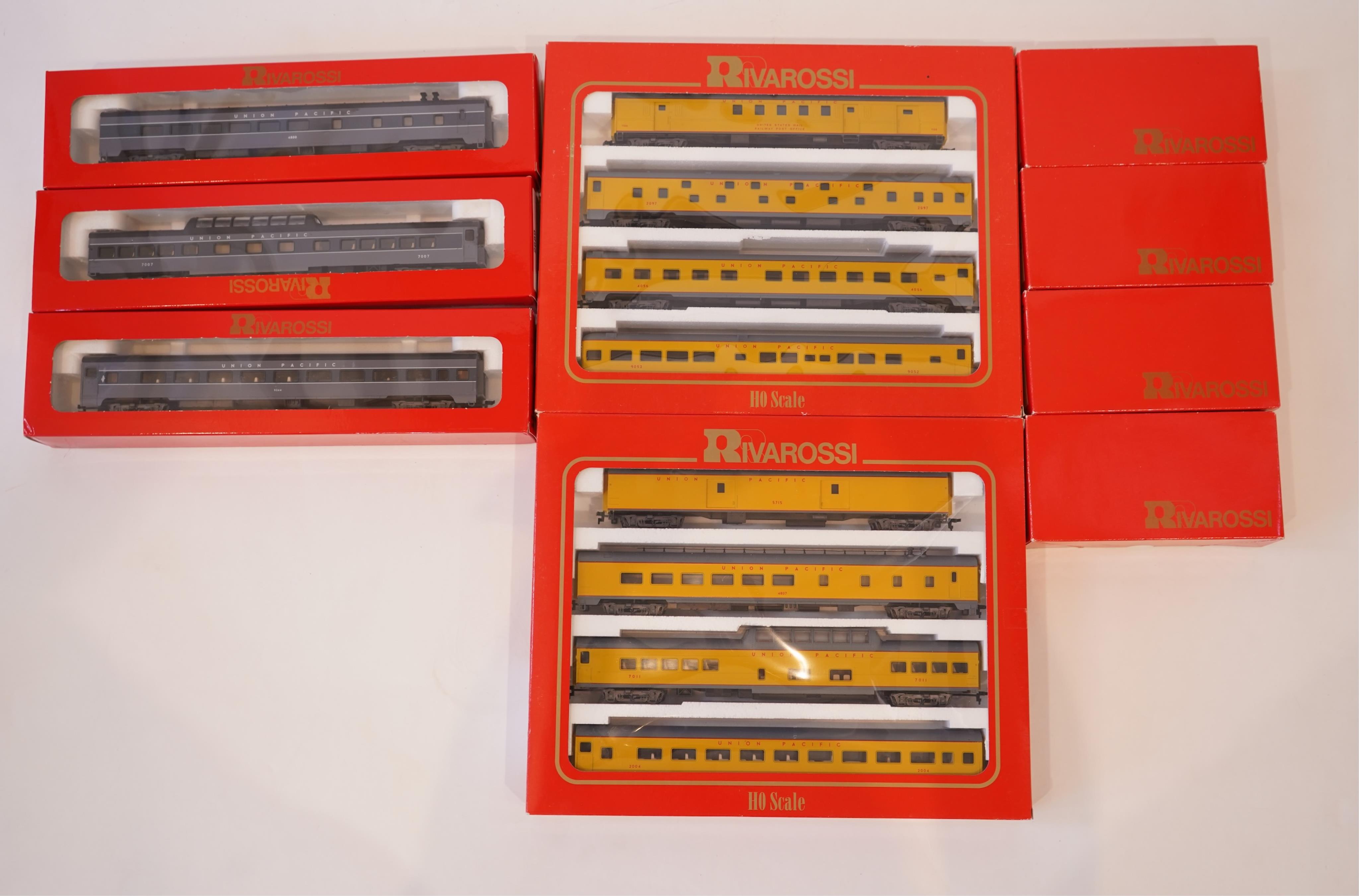 Two boxed Rivarossi 1930s Union Pacific coach packs; A Set (6964) and B Set (6965), both containing four coaches, together with three individually boxed coaches (2654, 2689 and 2814), plus four bogie freight wagons (2255